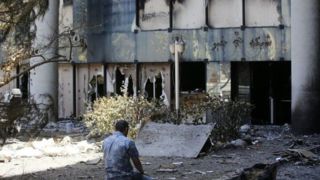 تصاویر پیکر شهید نیما رجب‌پور در کنار ساختمان شیشه‌ای صدا و سیما