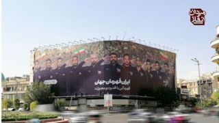 نقش کشتیگیران ایرانی بر دیوارنگاره میدان انقلاب نقش کشتیگیران ایرانی بر دیوارنگاره میدان انقلاب